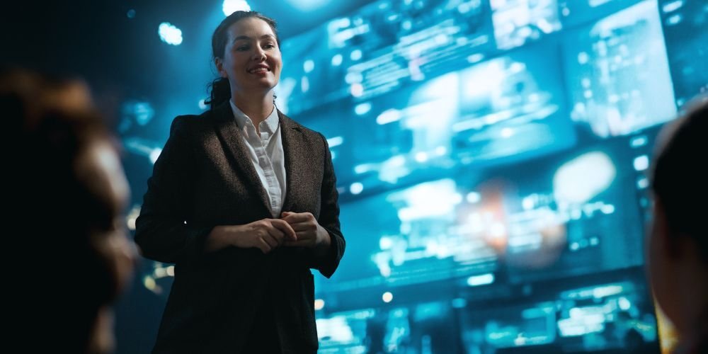 A confident speaker presenting cybersecurity data, tackling the top challenges of hiring a vCIO and offering actionable solutions.