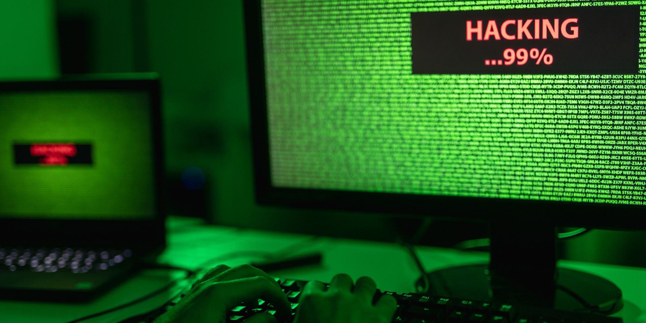 A hacking attempt in progress on a computer screen, raising questions about liability between a company and its MSP