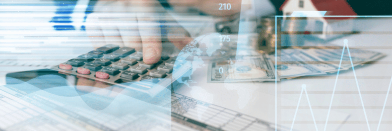 A person using a calculator to calculate finances with graphical overlays of percentages, graphs, and a small model house on a bed of cash in the foreground.