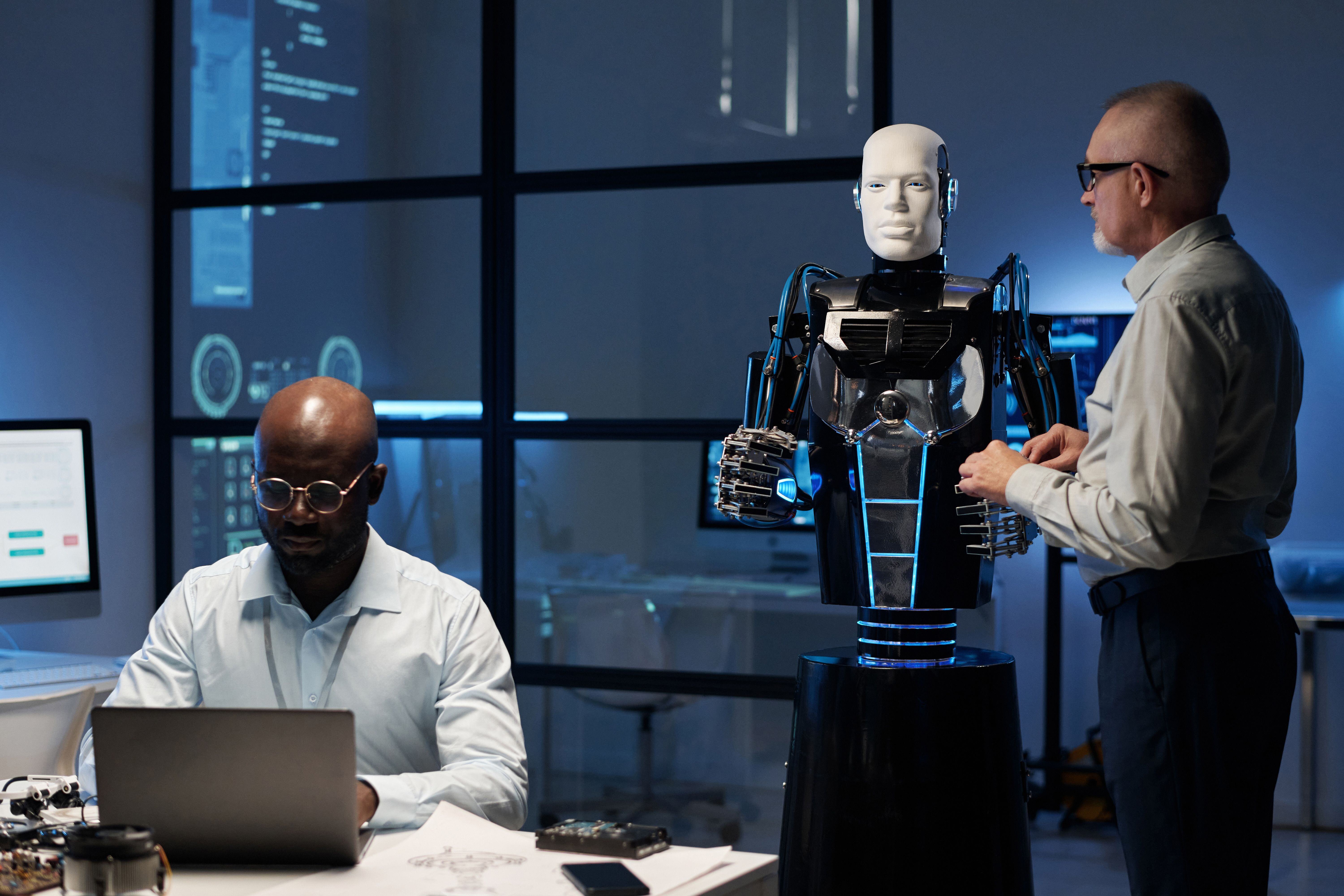 engineers-programming-robot-in-the-lab-2023-11-27-05-35-42-utc