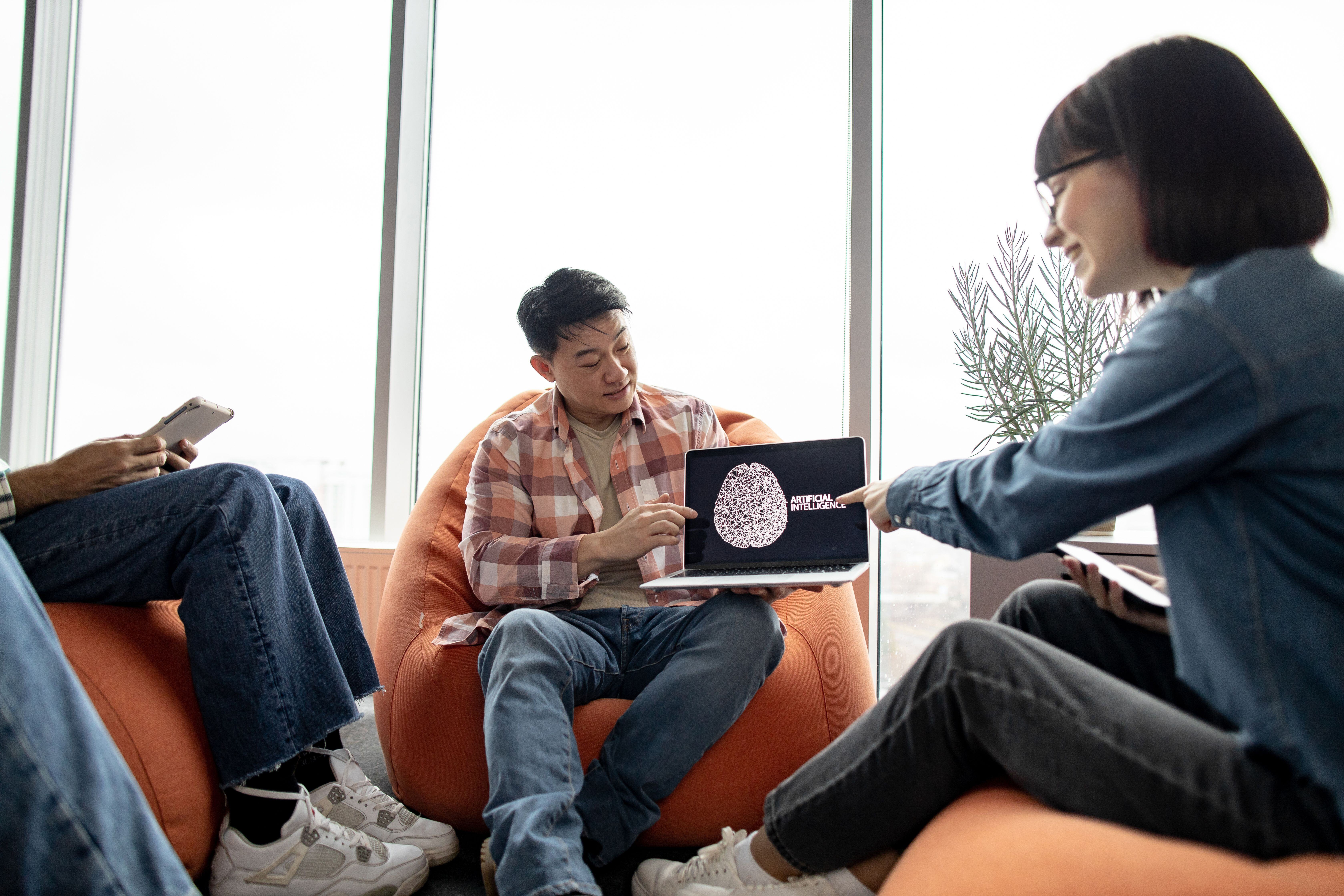 male-holding-laptop-with-ai-picture-in-office-with-2023-11-27-05-05-59-utc