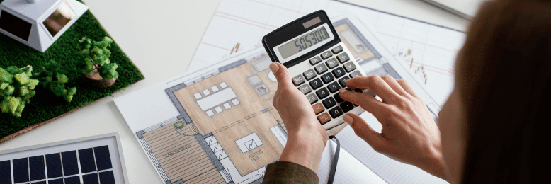 Architect using a calculator for managed IT budgeting