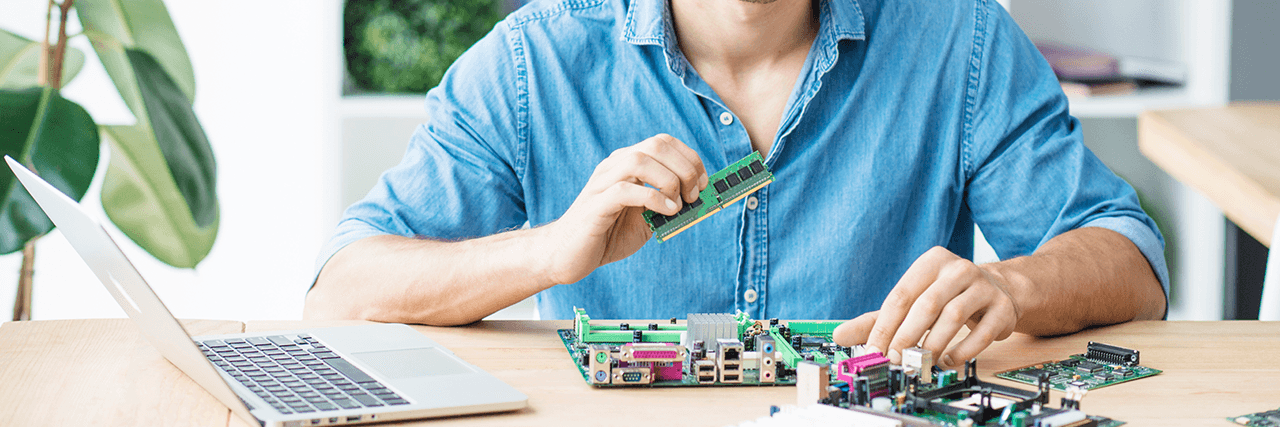 IT technician fixing broken equipment