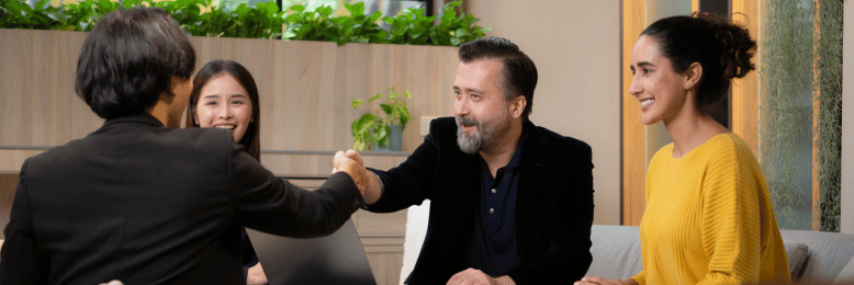 Business colleagues handshake over managed IT provider discussion