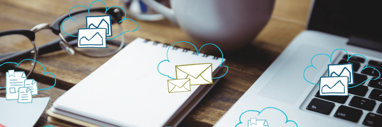 Cloud computing icons over a workspace, symbolizing business file-sharing solutions