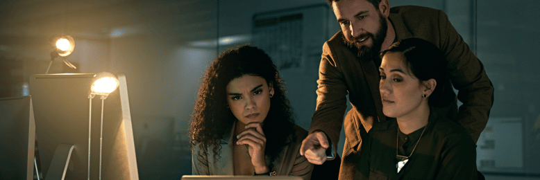 Colleagues reviewing security protocols to prevent email spoofing threats