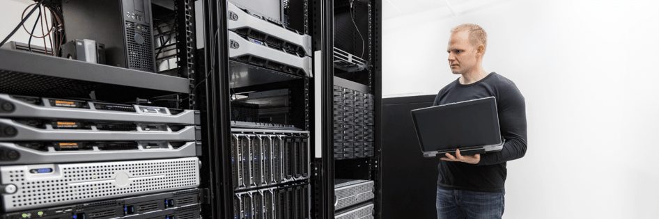 Technician Backing Up Data in Server room