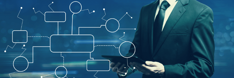 Businessman creating flowchart using Microsoft Visio