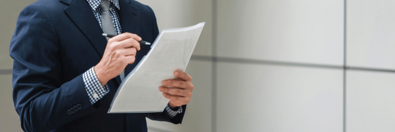 Focused businessman reviewing SEC cybersecurity disclosure documents