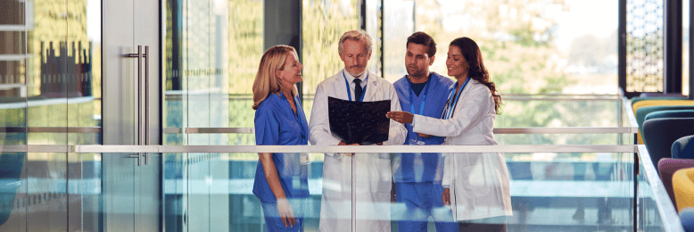 Healthcare professionals discussing over X-rays, a scenario in healthcare MSP services