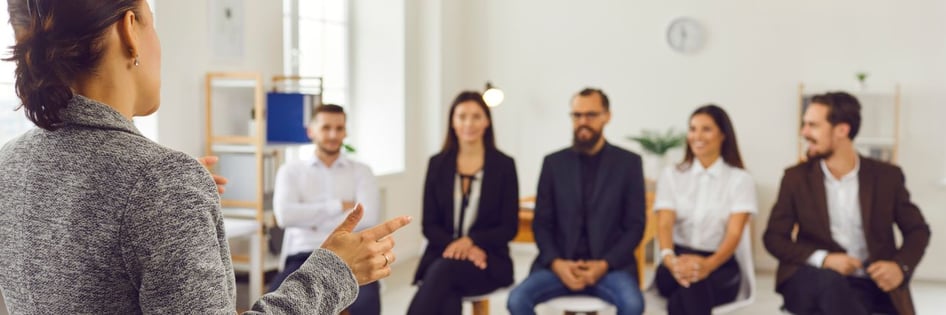A person giving a training to the staff about their new systems and technology