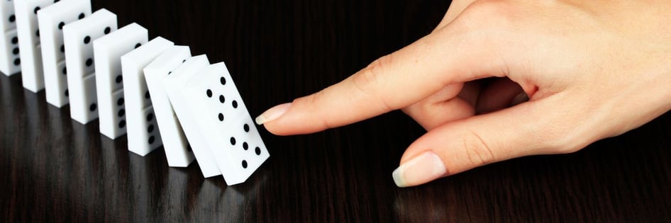 a person pushing domino tiles