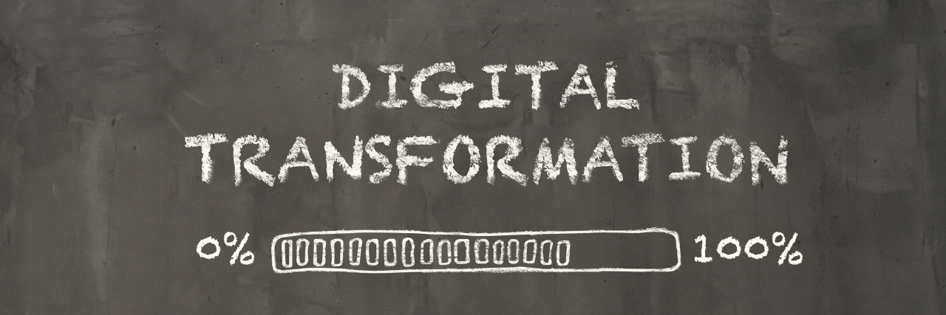 A blackboard with digital transformation written on it as it reached 100%