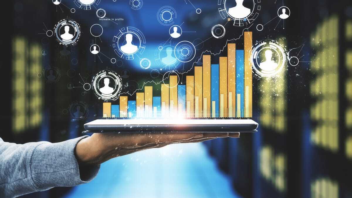 Hand holding a smartphone connected to business data