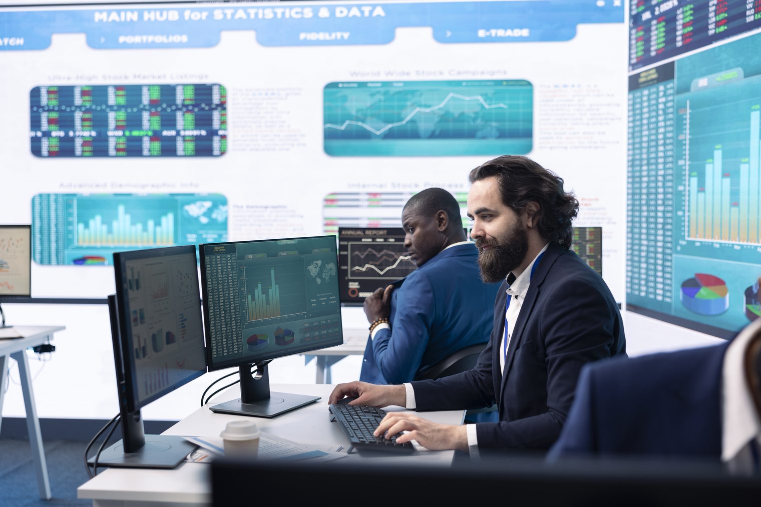An operations team monitoring a wall of live dashboards, standing in for AI agents running connected to business systems