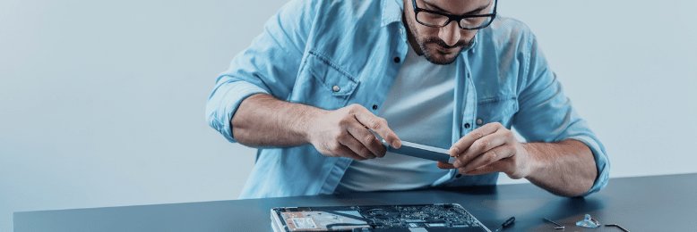 IT Technician working on a laptop
