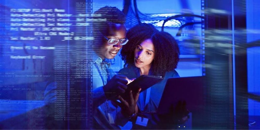 IT professionals review sensitive data, illustrating common business data breaches and cybersecurity mistakes