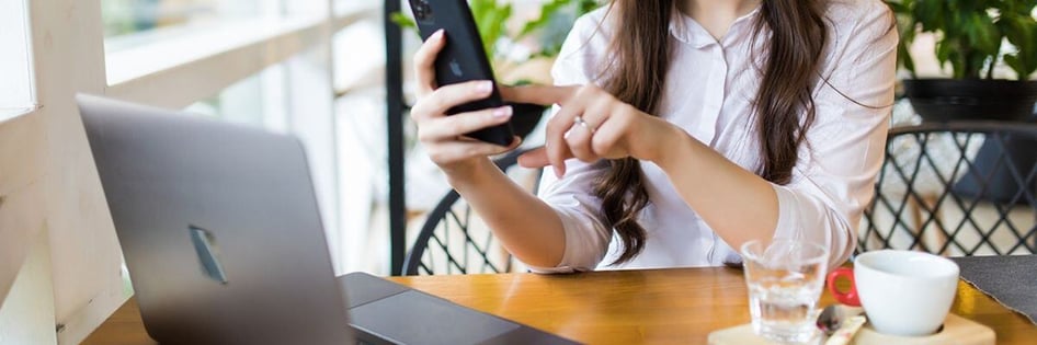 A person inputting checking MFA code in phone 