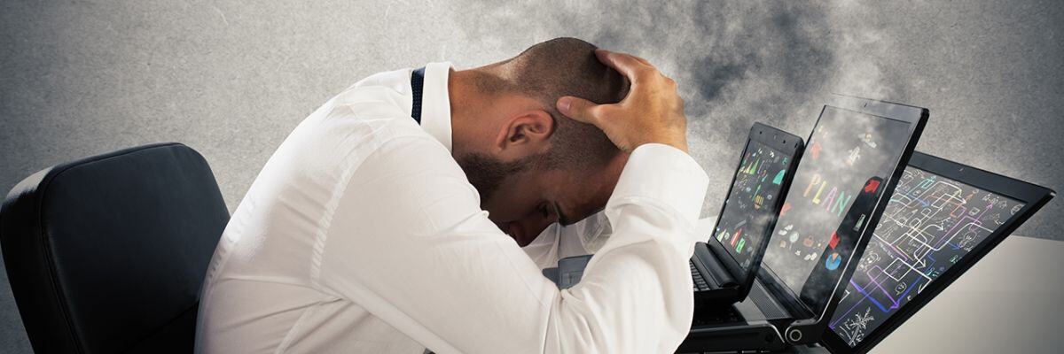 a person with a headache because of overheating laptop
