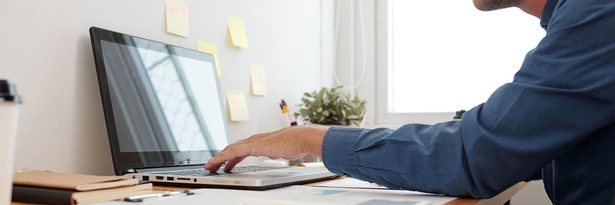 a person using his laptop for video conferencing