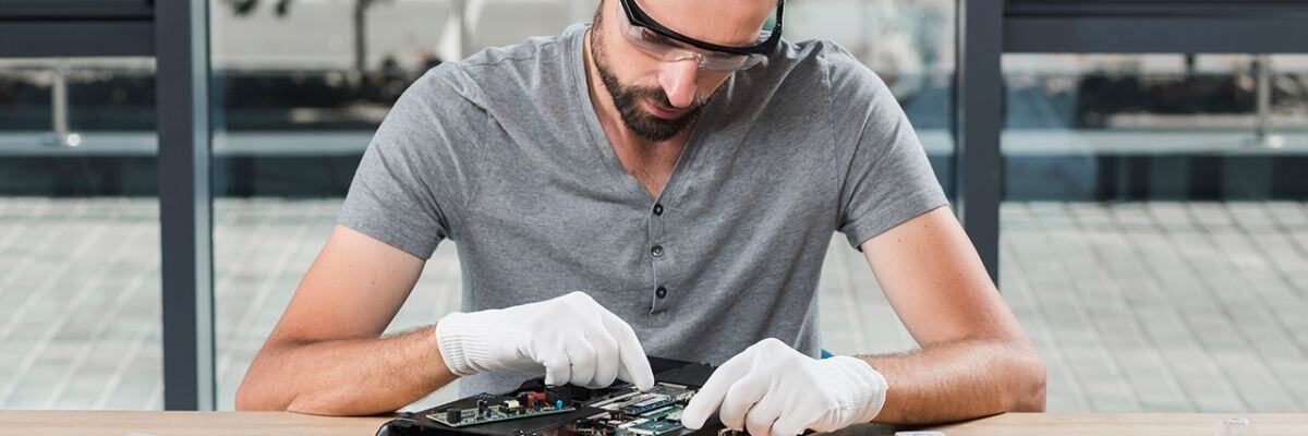 An IT technician doing preventive maintenance 