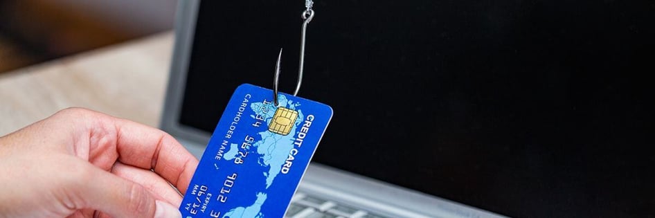 a credit card hooked signifying a phishing scam of credit card details