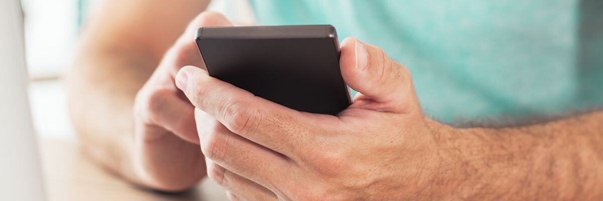 man holding his phone