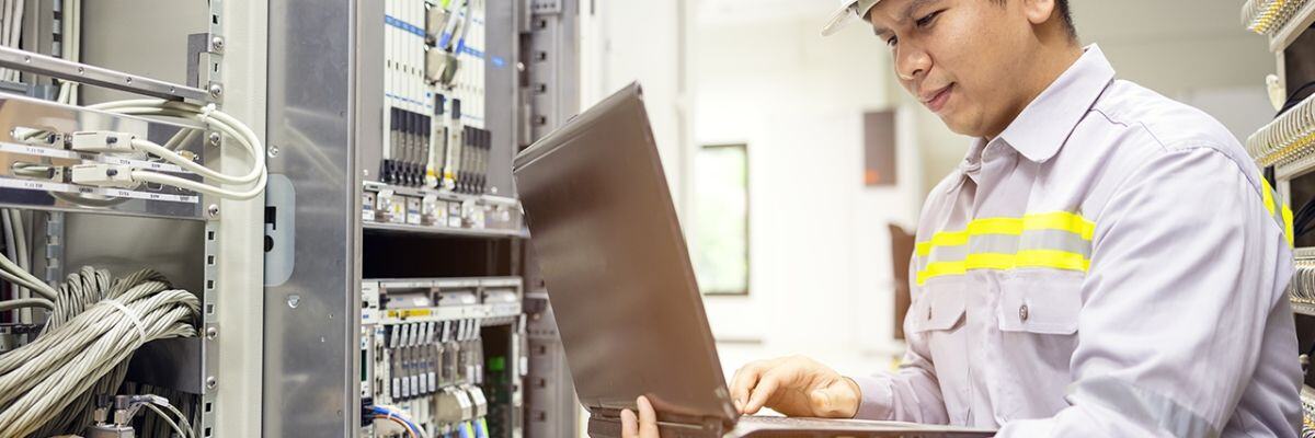 An IT technician doing a system check