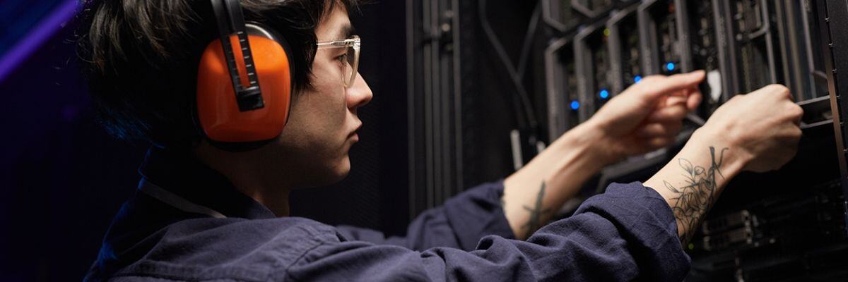 An IT Technician checking servers