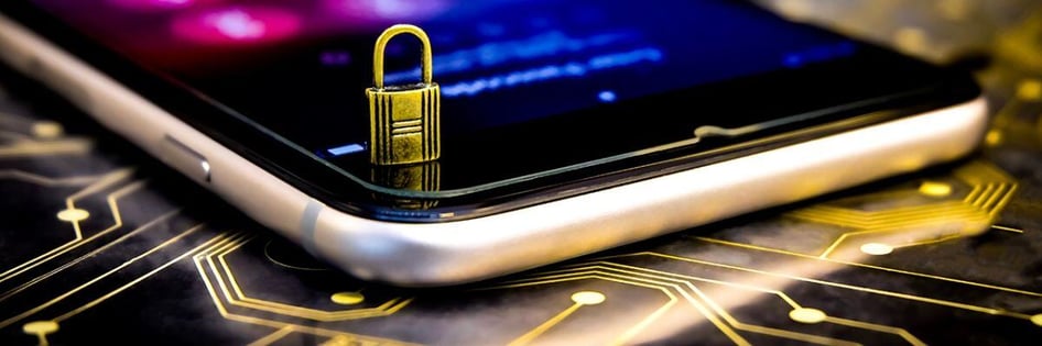 A small padlock on top of a cellphone