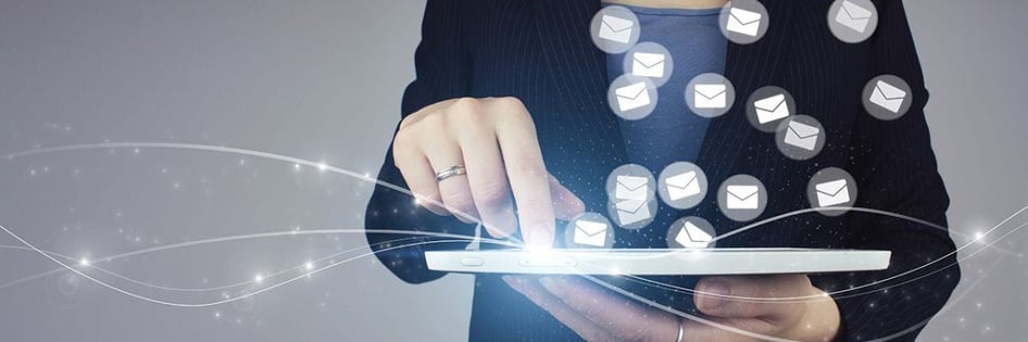 A person opening emails in a device