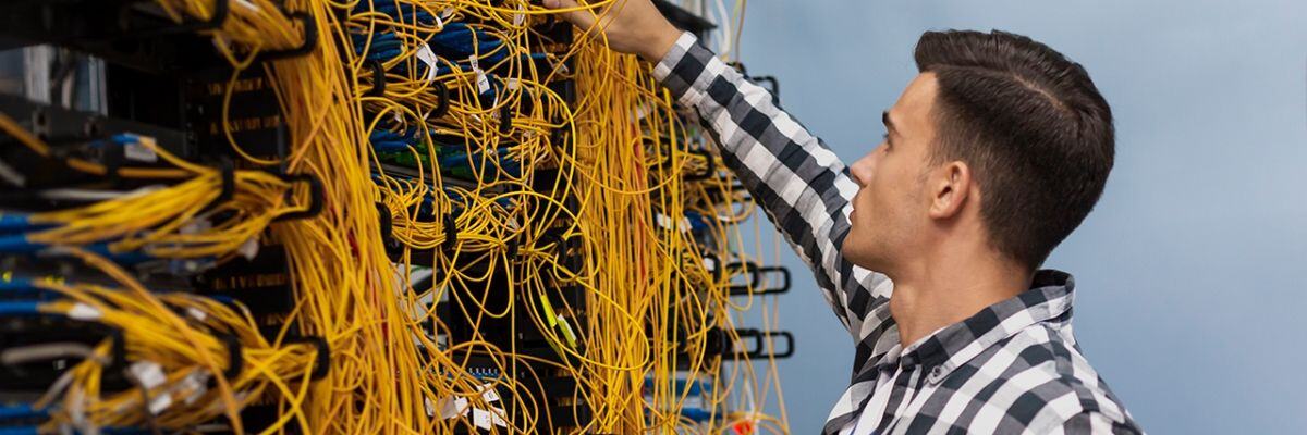 Person checking messy servers