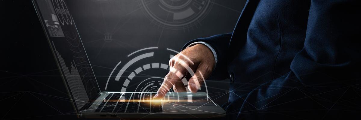 A person pointing to his laptop