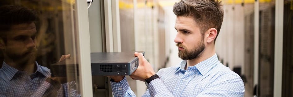 An IT Technician fixing an IT problem