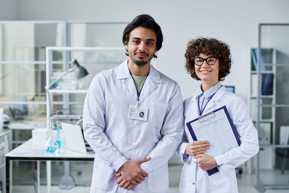 Two young clinicians in labcoats