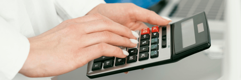 Professional calculating figures for co-managed IT services budgeting