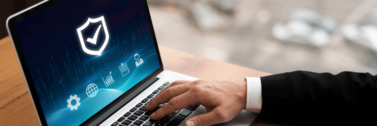 Professional conducting a network security assessment on a laptop