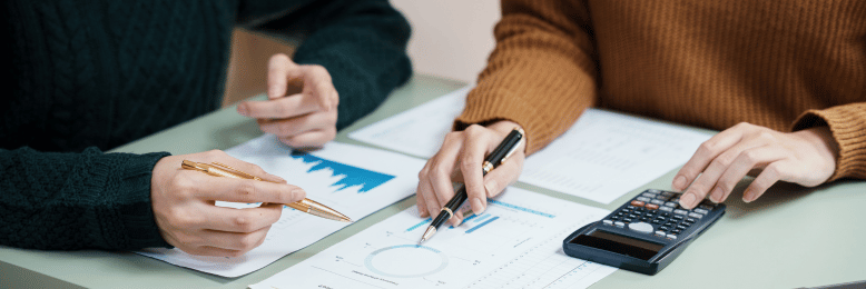 Professionals comparing managed IT provider metrics and performance charts