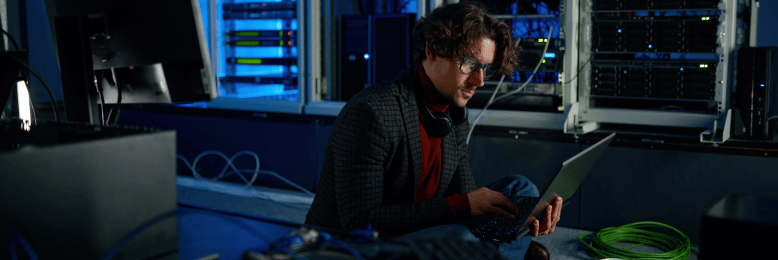 System administrator in a server room working on threat isolation and network containment