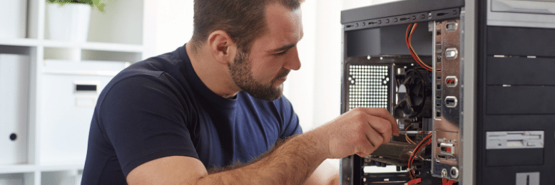 Technician Fixing a Broken Computer