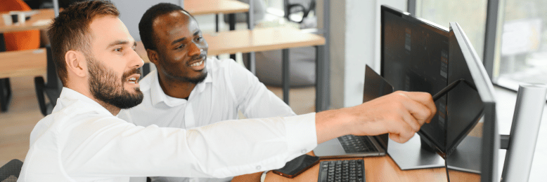 Two IT experts collaborating at the office, serving as vendor liaisons for software solutions
