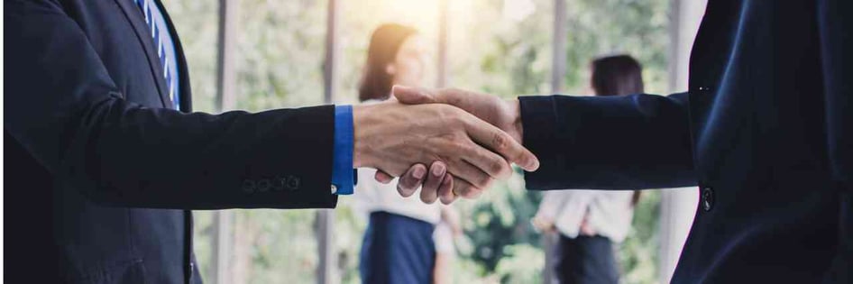 CEOs shaking hands for a business deal