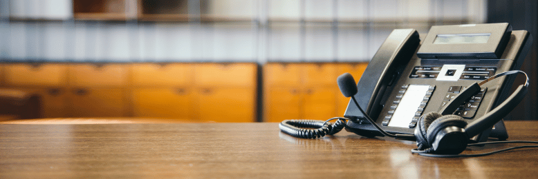 a headset with telephone (voip) on the table