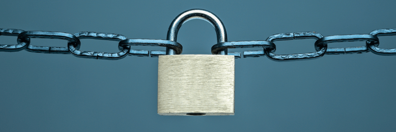 a padlock being pulled by chains