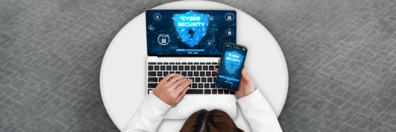 a person establishing cybersecurity in laptop and phone