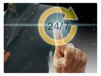 a person pointing to a holographic image of 24 7