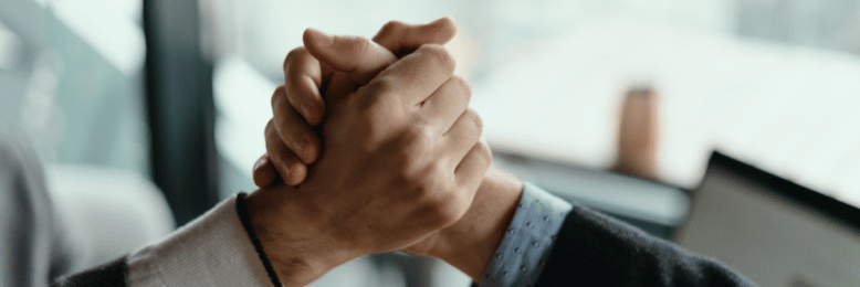 a person shaking hands with another person