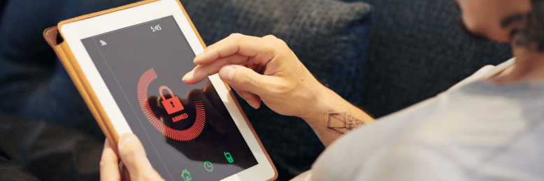a person using an armed cybersecurity tablet