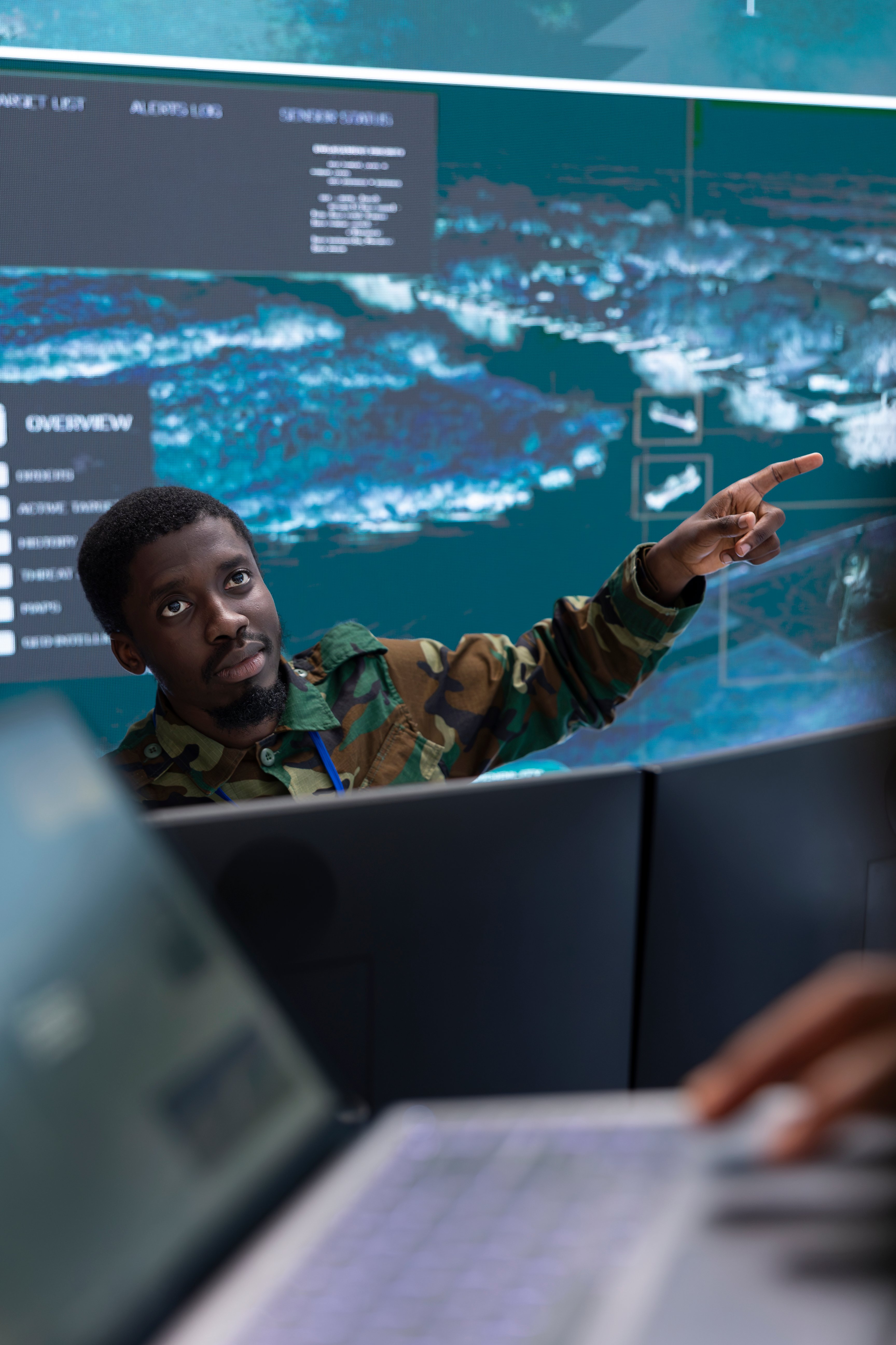 army-specialists-use-computer-systems-and-big-scre-2025-02-20-00-59-25-utc