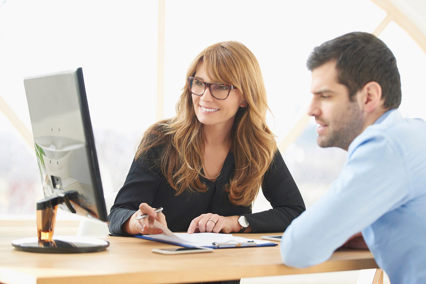 businesswoman-sitting-at-desk